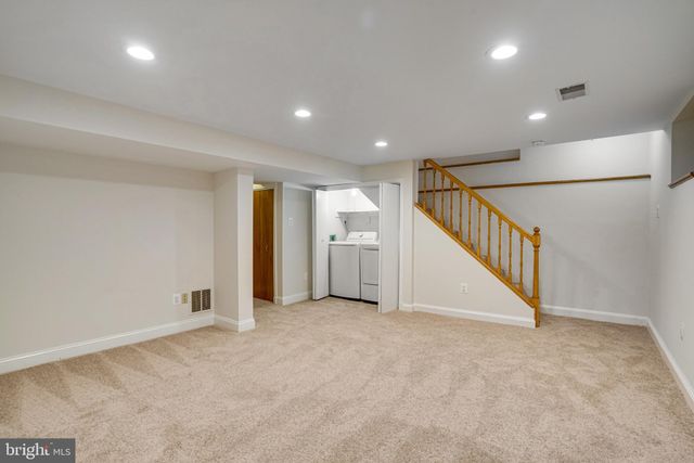 a view of an empty room with stairs
