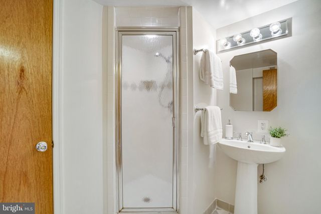 a bathroom with a sink and mirror