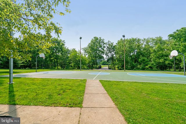 a view of a swimming pool with a yard