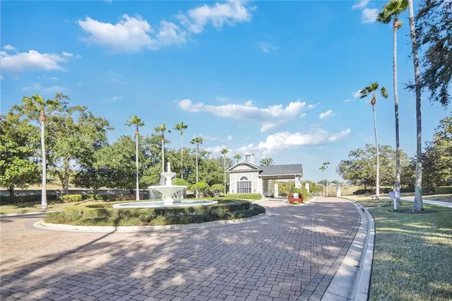 a view of a lake with houses in the back