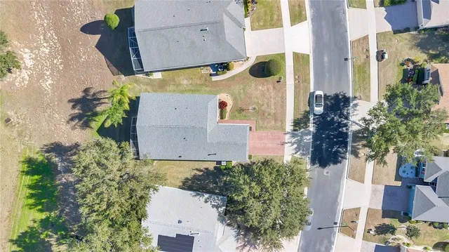 an aerial view of a residential houses with outdoor space