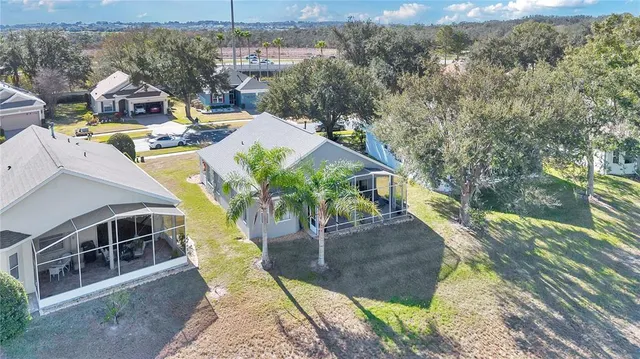 an aerial view of a house with a swimming pool