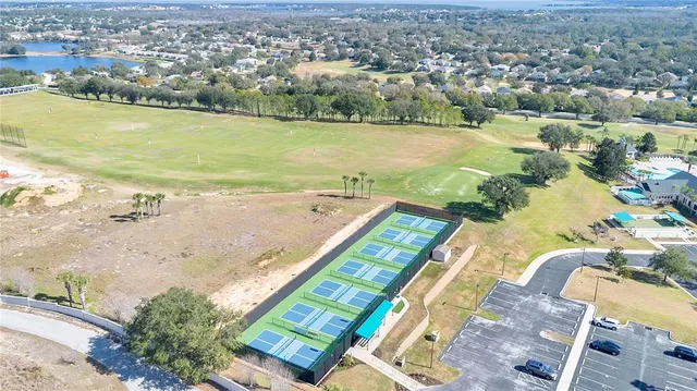 an aerial view of a house with a swimming pool