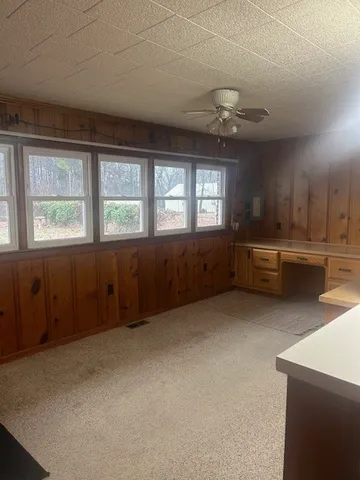 a view of a kitchen with a sink and a window