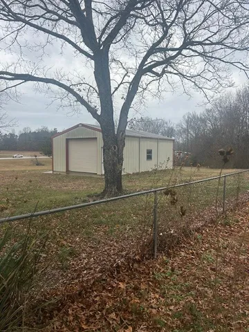 a view of a backyard of the house