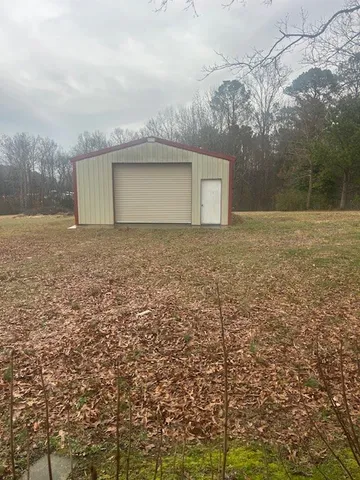 a view of a yard with a tree