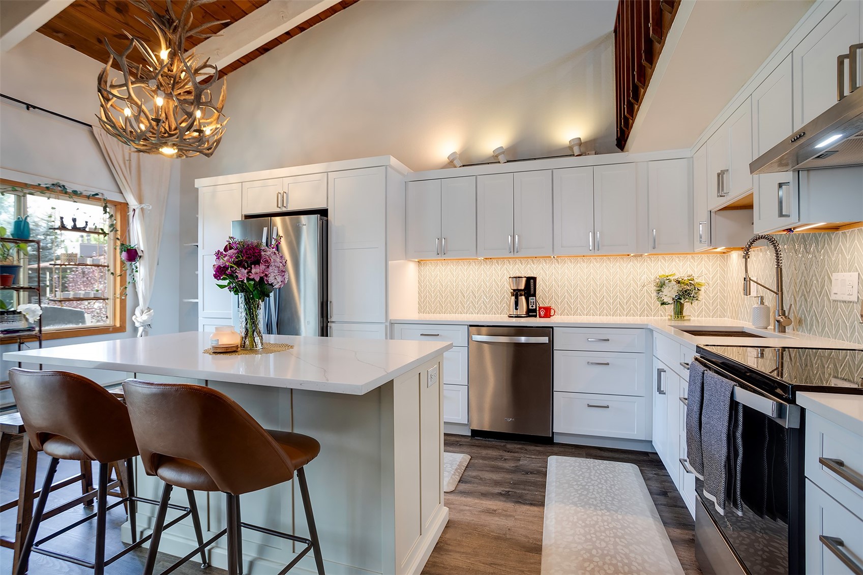 a kitchen with stainless steel appliances granite countertop a sink counter space and cabinets