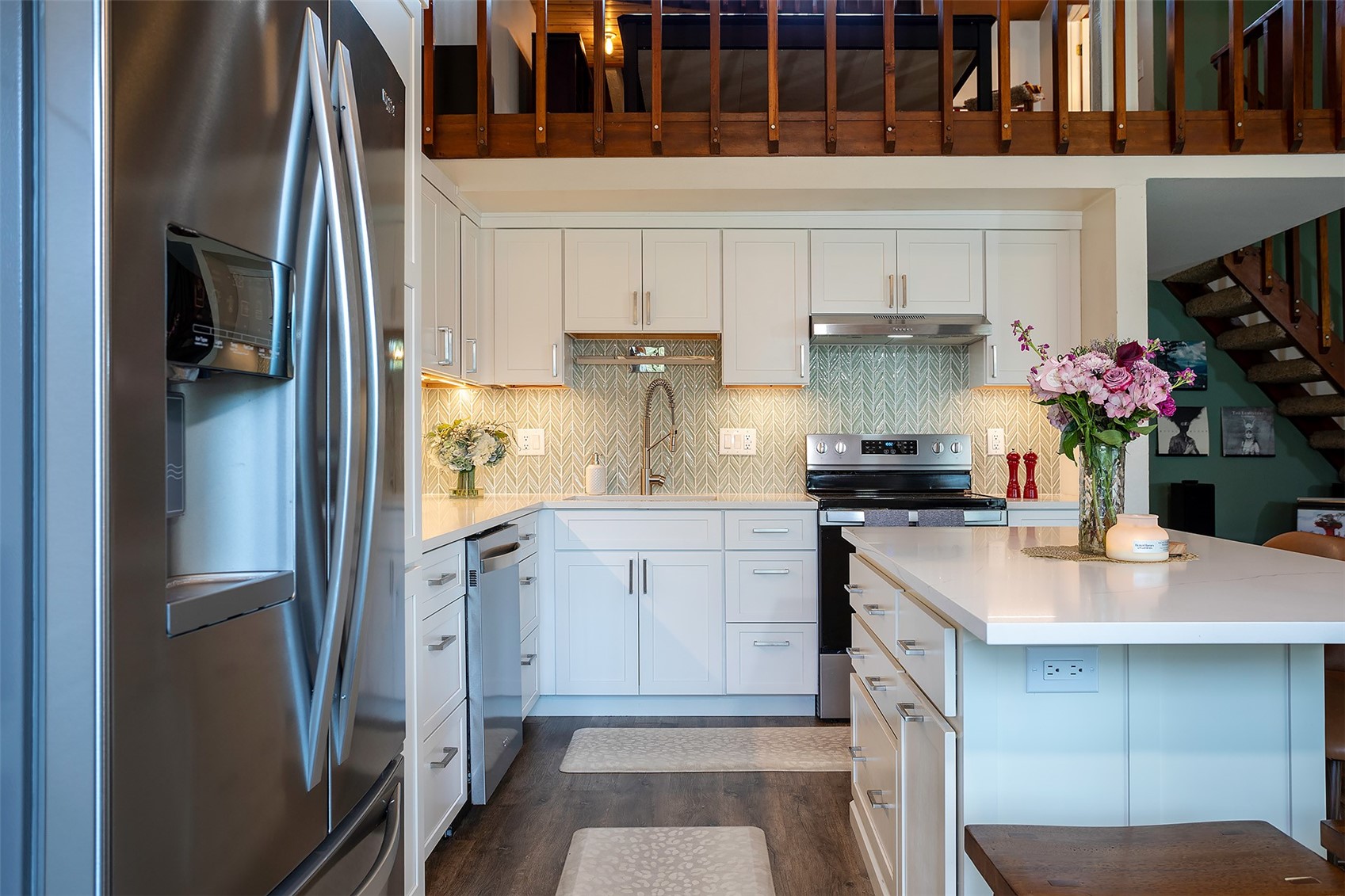 1355 Walton Creek Road, Unit 21 Steamboat Springs, CO 80487 - Photo 6 of 27 a kitchen with a sink refrigerator and cabinets