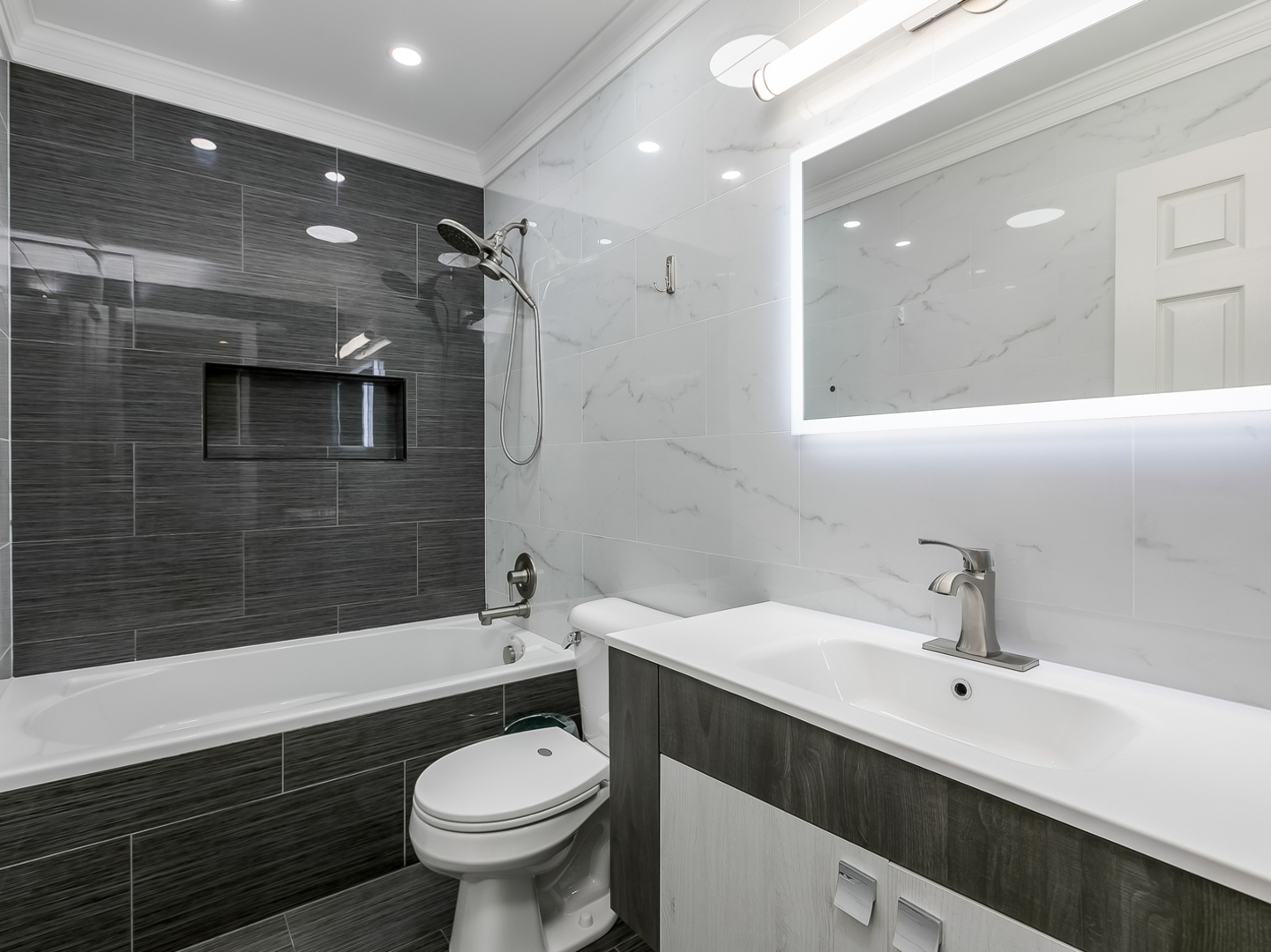 2331 Overlook Court Naperville, IL 60563 - Photo 12 of 27 a bathroom with a sink a toilet a mirror and shower