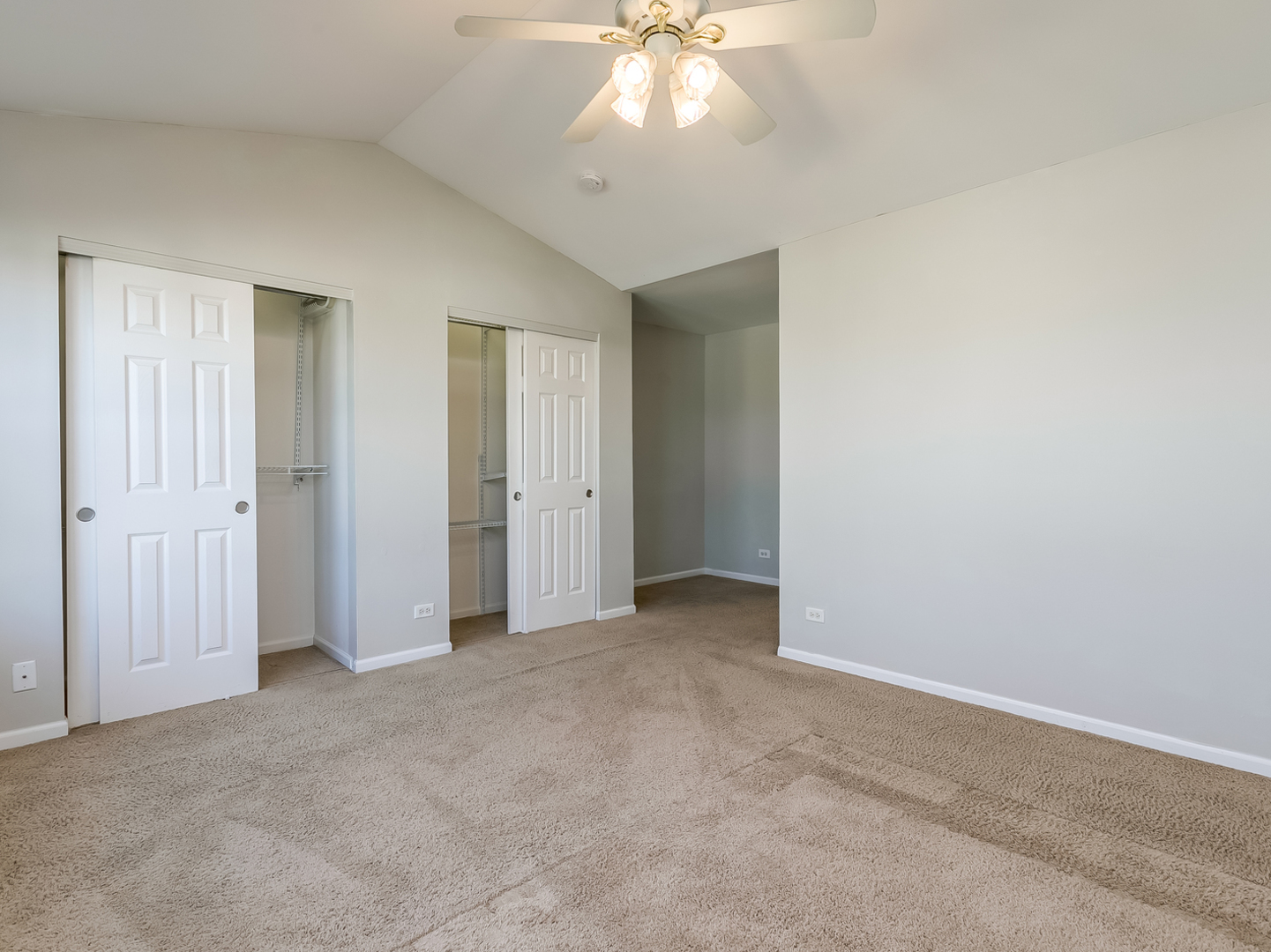2331 Overlook Court Naperville, IL 60563 - Photo 15 of 27 an empty room with closet and a chandelier fan