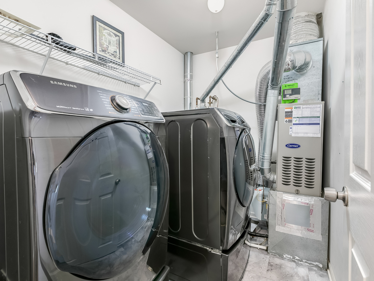 2331 Overlook Court Naperville, IL 60563 - Photo 20 of 27 a utility room with wooden floor and fan