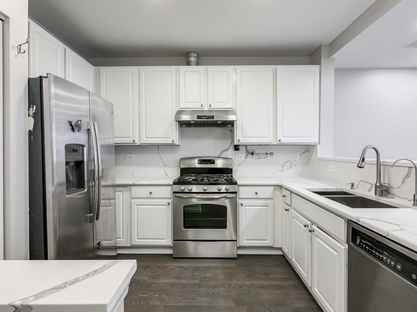 2331 Overlook Court Naperville, IL 60563 - Photo 6 of 27 a kitchen with a stove sink and refrigerator