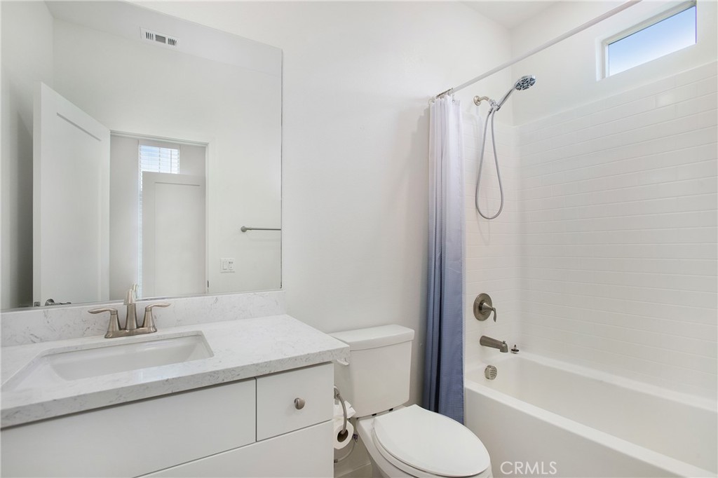 148 Acamar Irvine, CA 92618 - Photo 12 of 23 a bathroom with a granite countertop sink toilet and shower