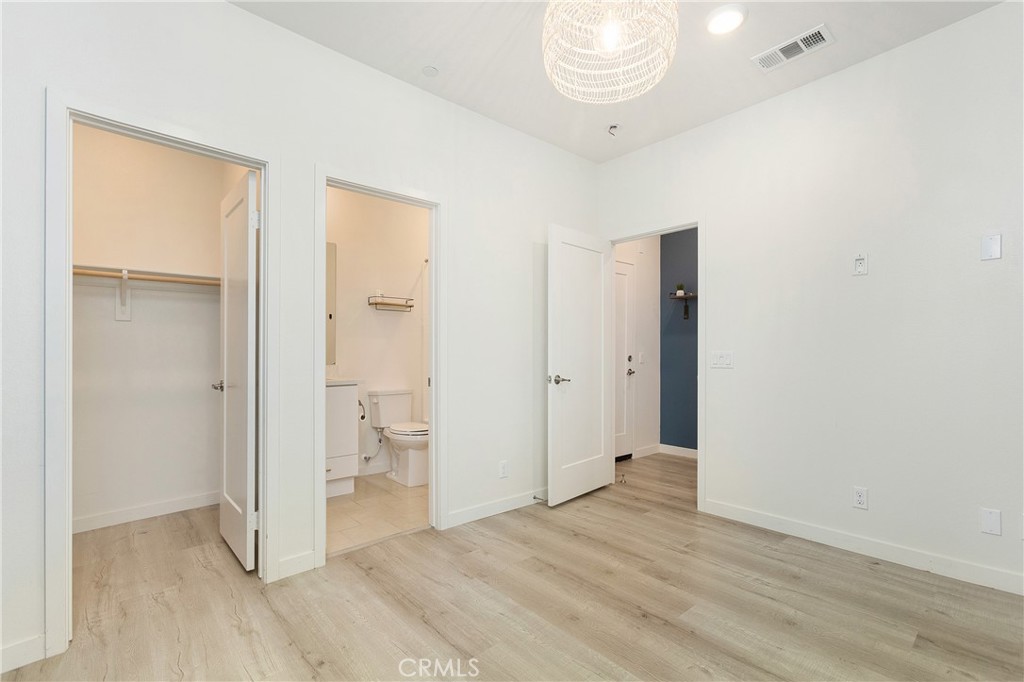 148 Acamar Irvine, CA 92618 - Photo 13 of 23 a view of an empty room and wooden floor