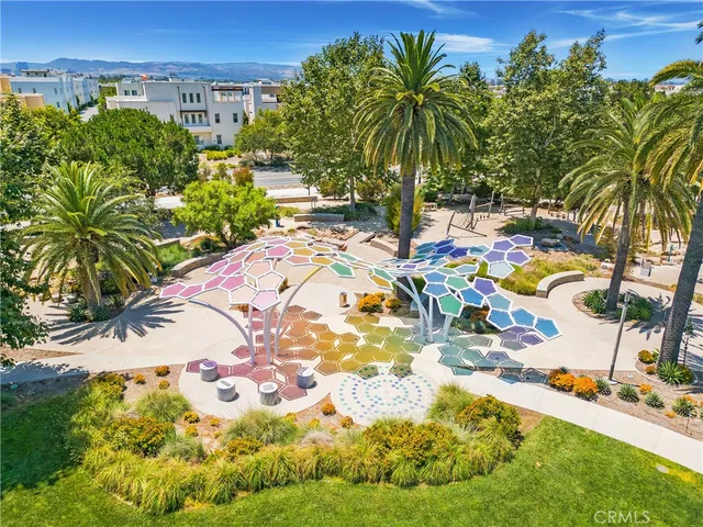 an aerial view of residential houses with yard