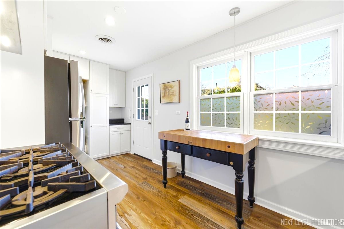 515 3rd Street Wilmette, IL 60091 - Photo 13 of 26 a kitchen with a stove and a window