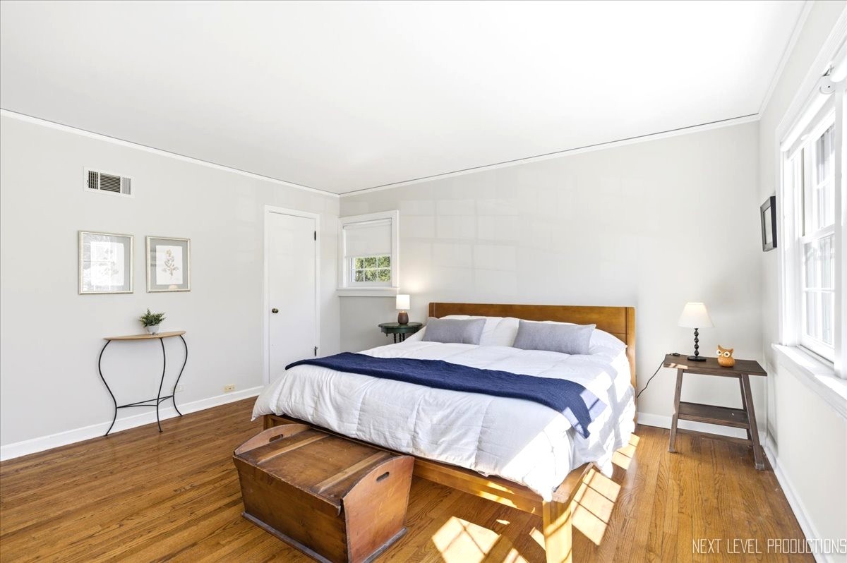 515 3rd Street Wilmette, IL 60091 - Photo 17 of 26 a bedroom with a bed and wooden floor