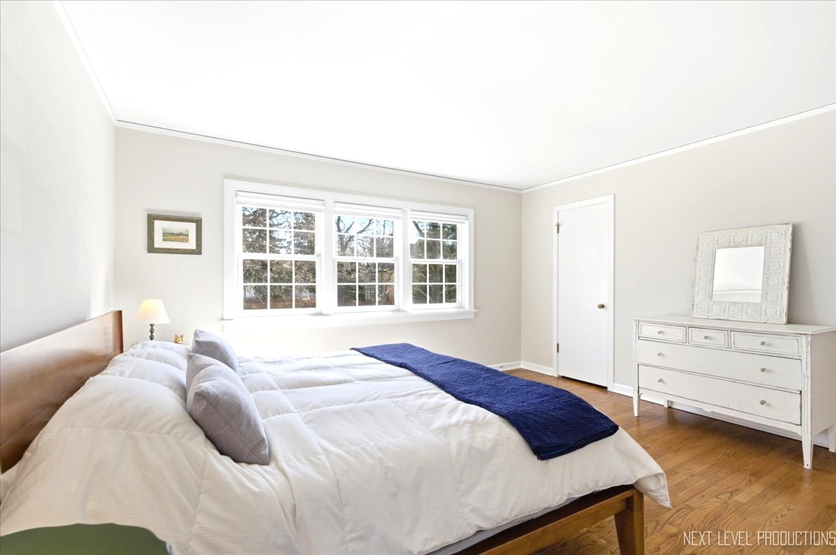 515 3rd Street Wilmette, IL 60091 - Photo 19 of 26 a bedroom with a bed and a window