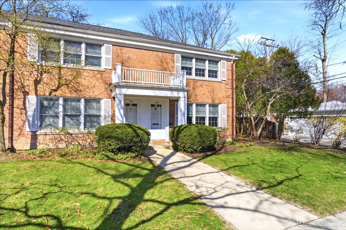 515 3rd Street Wilmette, IL 60091 - Photo 2 of 26 a view of a brick building next to a yard