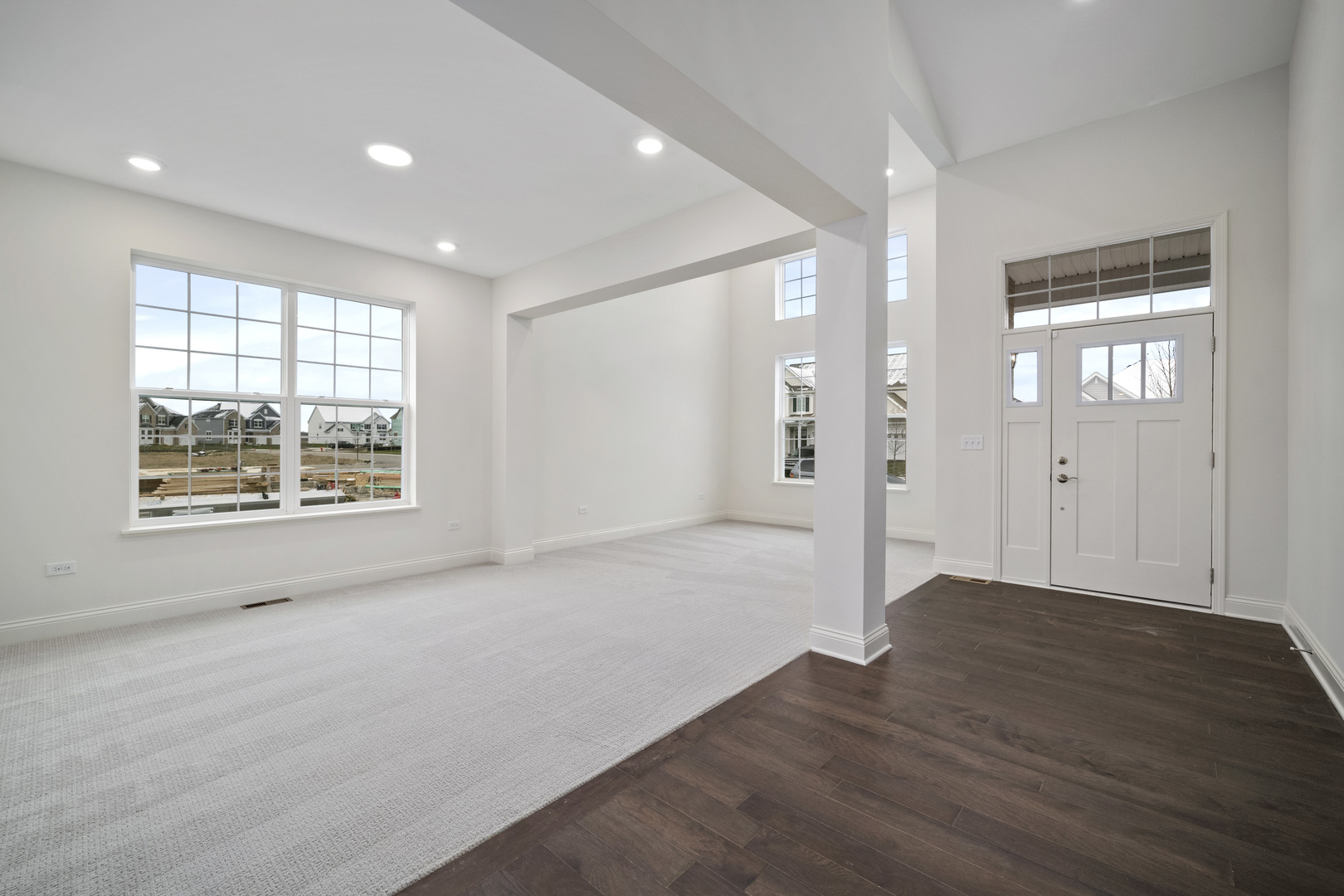 3657 Edelweiss Road Elgin, IL 60124 - Photo 3 of 24 an empty room with wooden floor and windows