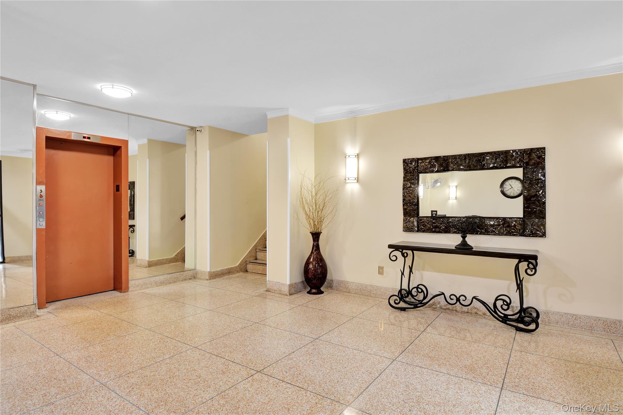 315 West 232nd Street, Unit 1F Bronx, NY 10463 - Photo 14 of 18 Corridor featuring elevator, stairway, and ornamental molding