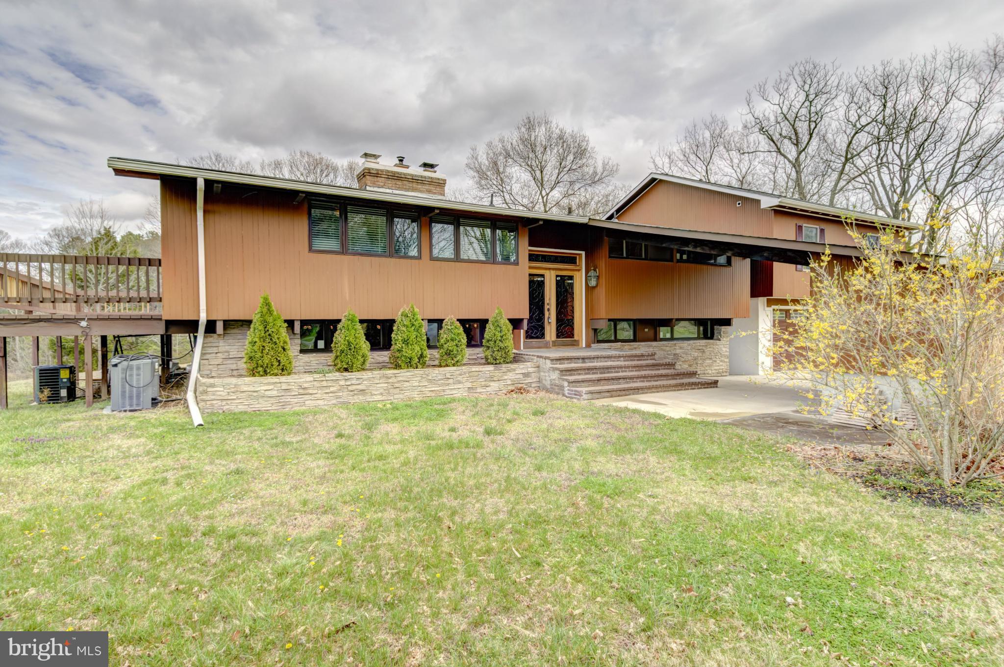 3381 Carroll Road Huntingtown, MD 20639 - Photo 2 of 30 a front view of a house with a yard