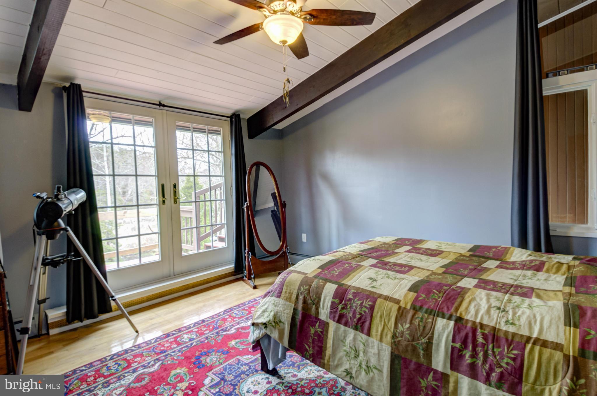 3381 Carroll Road Huntingtown, MD 20639 - Photo 13 of 30 a bedroom with a bed next to a window