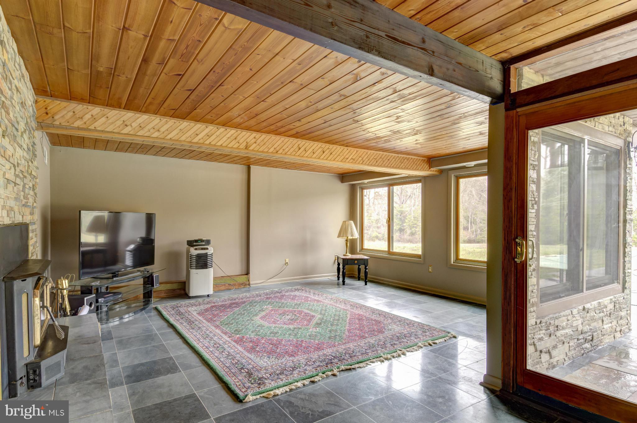 3381 Carroll Road Huntingtown, MD 20639 - Photo 22 of 30 a spacious bedroom with a bed next to a window