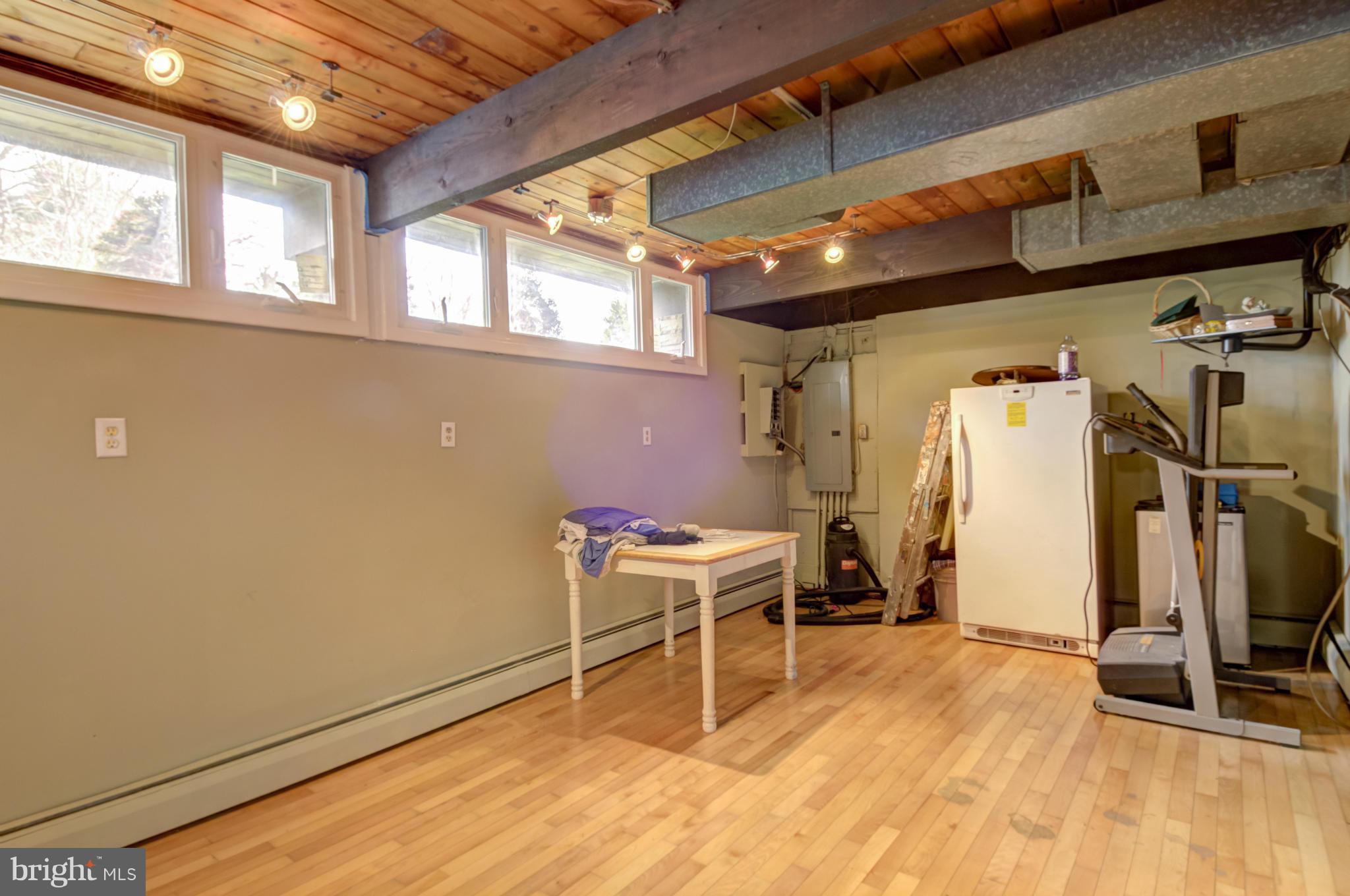 3381 Carroll Road Huntingtown, MD 20639 - Photo 24 of 30 a view of a room with wooden floor and windows