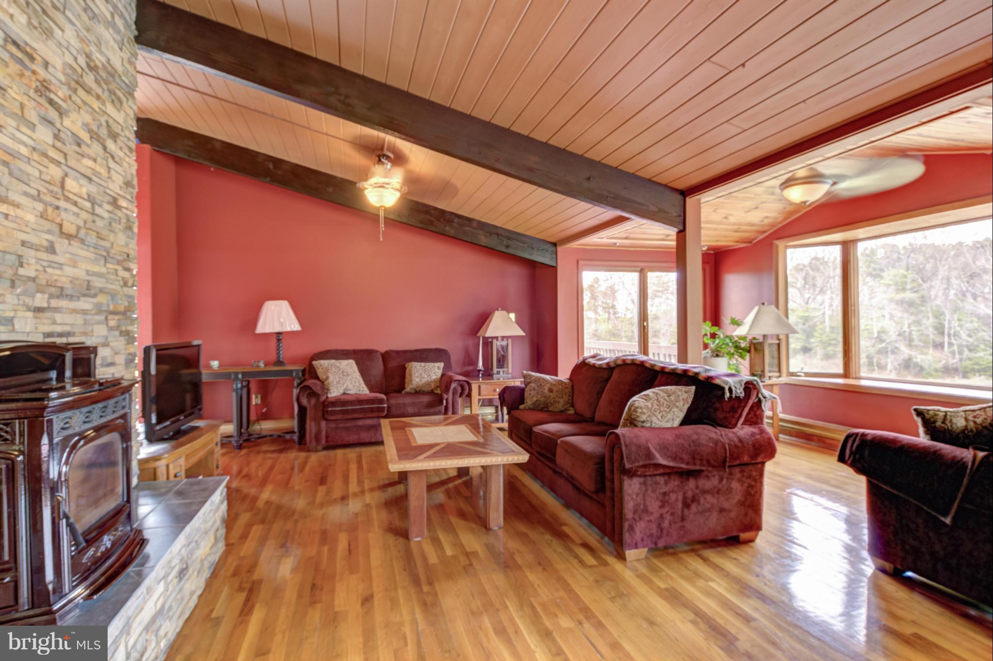 3381 Carroll Road Huntingtown, MD 20639 - Photo 6 of 30 a living room with furniture and a fireplace