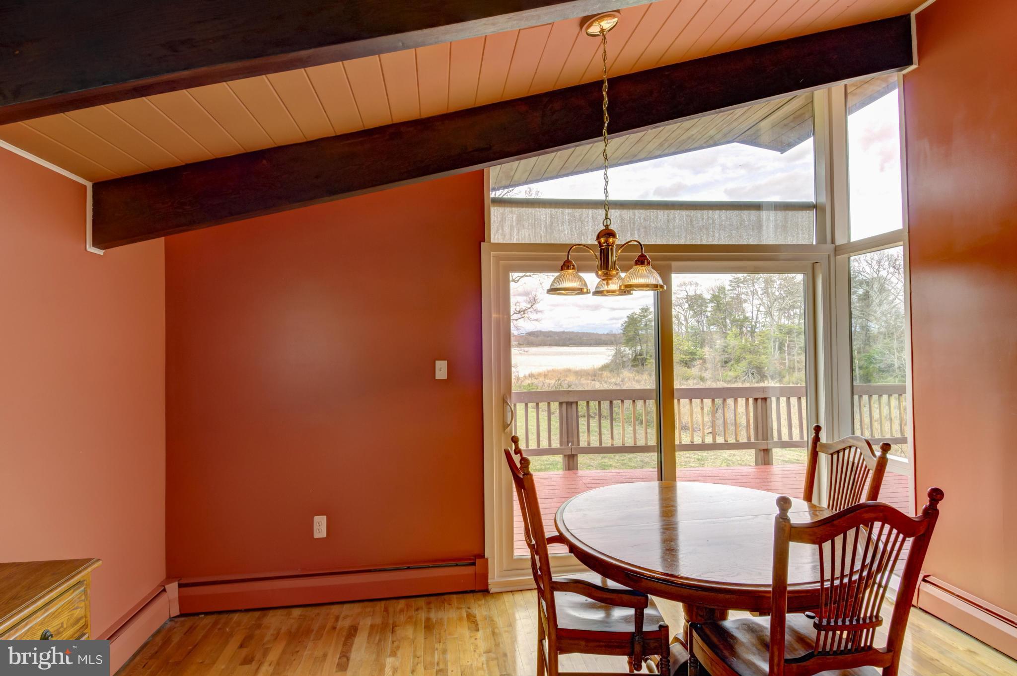 3381 Carroll Road Huntingtown, MD 20639 - Photo 8 of 30 a balcony with table and chairs