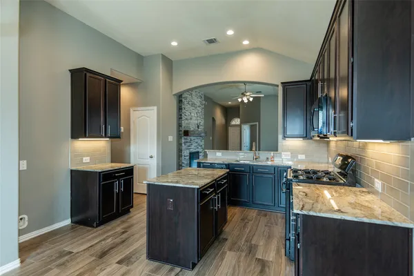 a kitchen with a stove and a sink