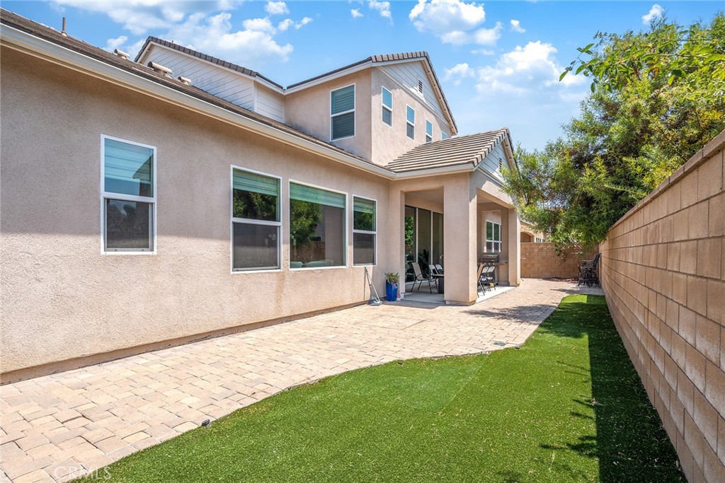 61 Windwalker Way Tustin, CA 92782 - Photo 13 of 62 a front view of a house with a yard