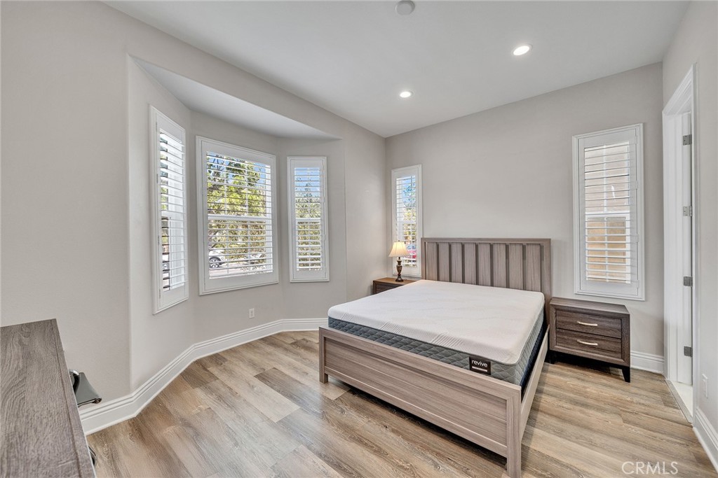 61 Windwalker Way Tustin, CA 92782 - Photo 16 of 62 a bedroom with a bed and a window