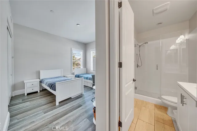 a bed room with furniture and a large window