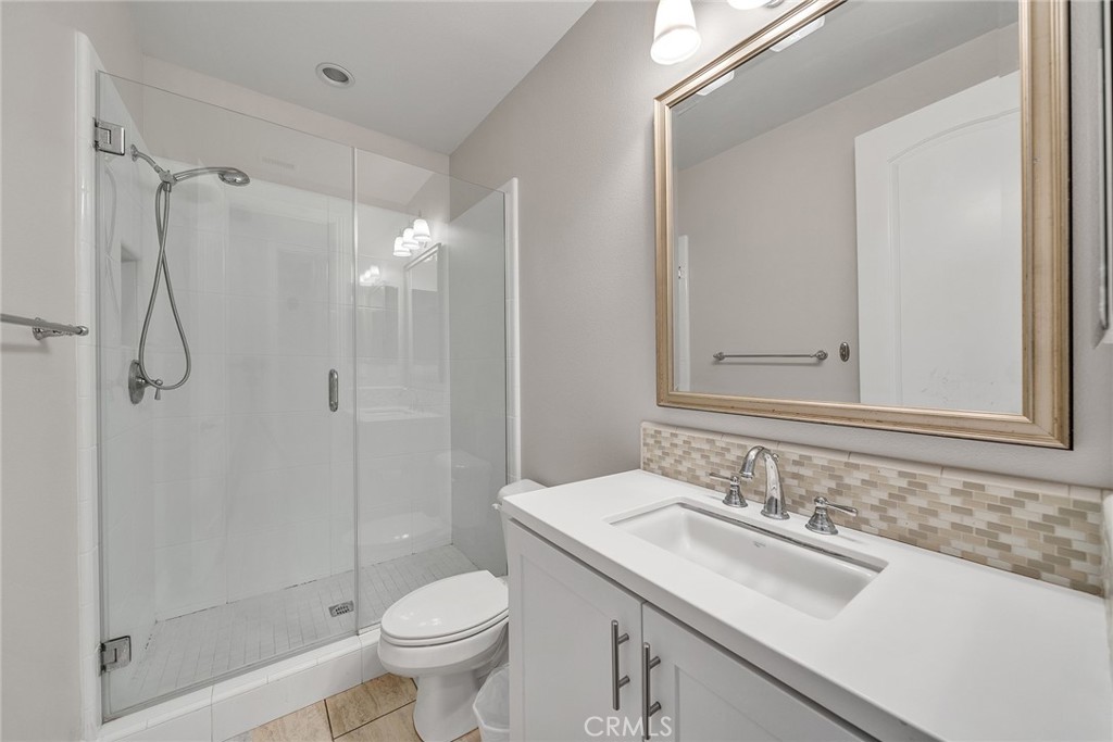 61 Windwalker Way Tustin, CA 92782 - Photo 21 of 62 a bathroom with a sink toilet and shower
