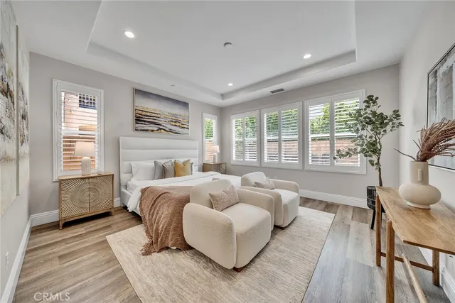 a spacious bathroom with a tub a sink and a mirror