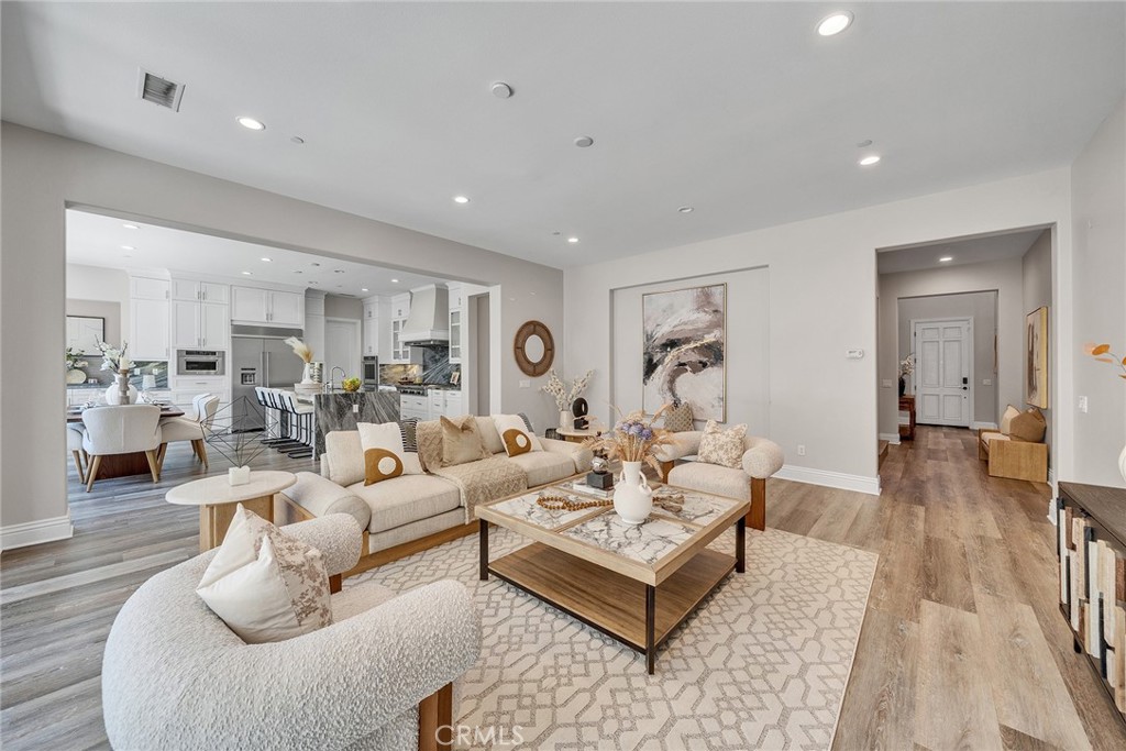61 Windwalker Way Tustin, CA 92782 - Photo 3 of 62 a living room with furniture or couch and a wooden floor