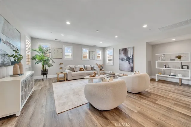a bathroom with a sink toilet vanity and shower