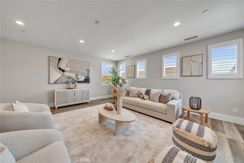 61 Windwalker Way Tustin, CA 92782 - Photo 36 of 62 a living room with furniture and a table