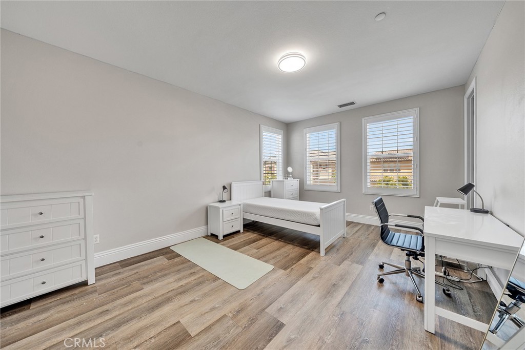 61 Windwalker Way Tustin, CA 92782 - Photo 38 of 62 a living room with furniture and a wooden floor