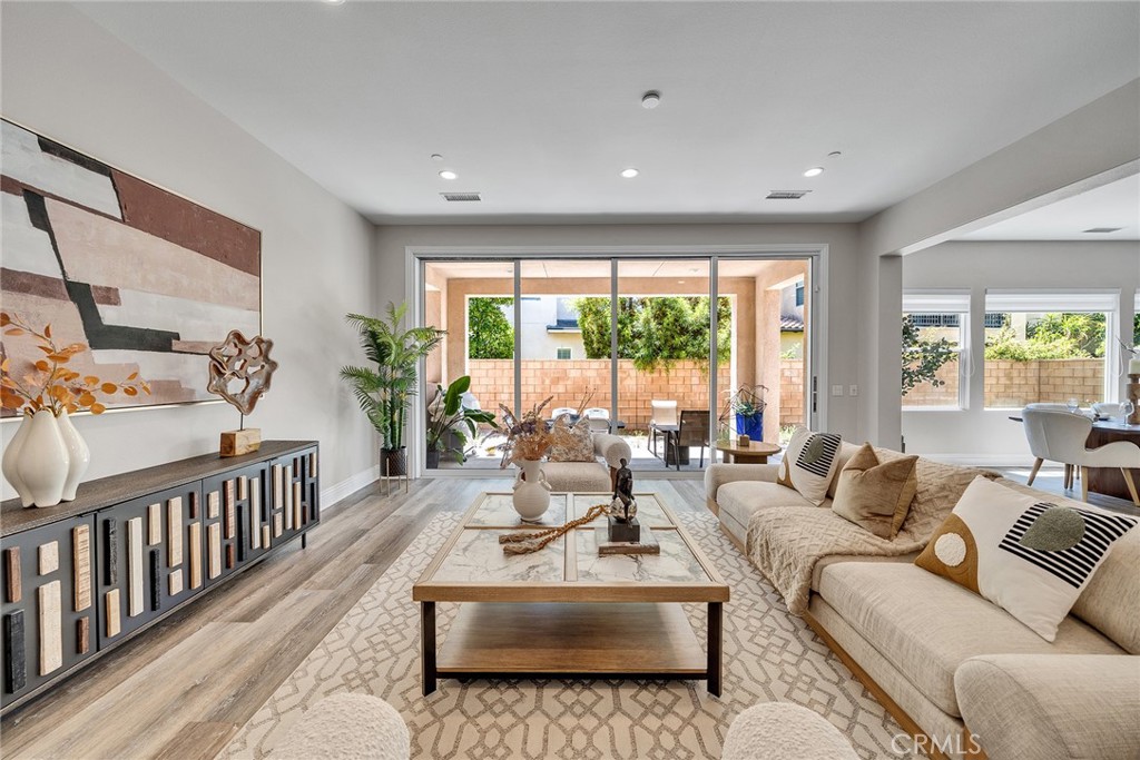 61 Windwalker Way Tustin, CA 92782 - Photo 4 of 62 a living room with furniture and a large window