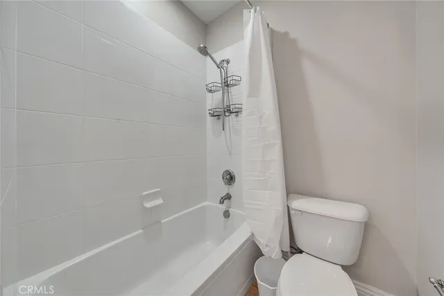 a view of a playground and basketball court