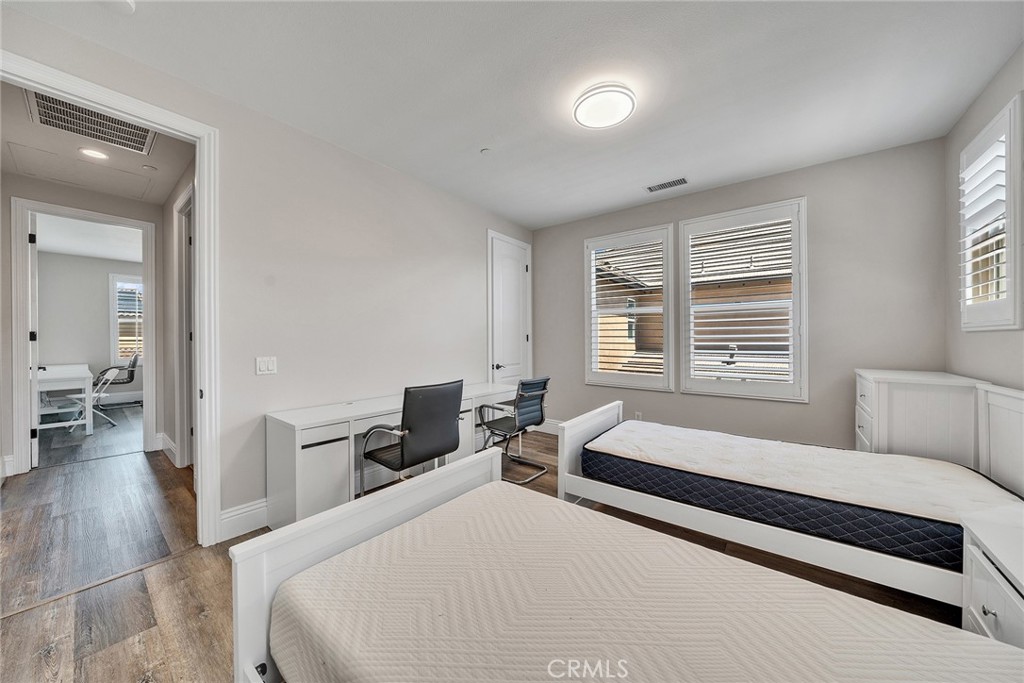 61 Windwalker Way Tustin, CA 92782 - Photo 45 of 62 a bedroom with furniture and a large window