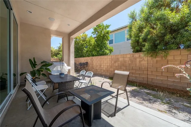 an aerial view of a house with a garden and lake view