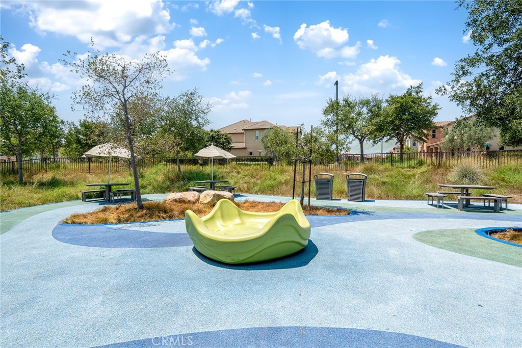 61 Windwalker Way Tustin, CA 92782 - Photo 47 of 62 a view of a swimming pool with a patio and a yard