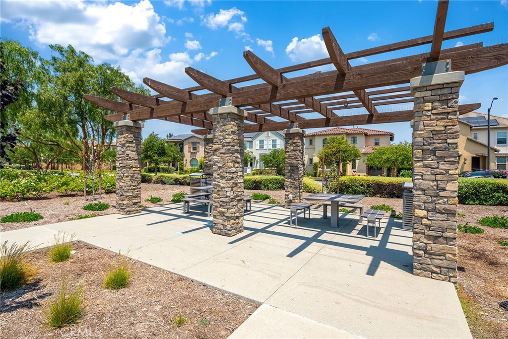 61 Windwalker Way Tustin, CA 92782 - Photo 52 of 62 a view of a patio with a table and chairs