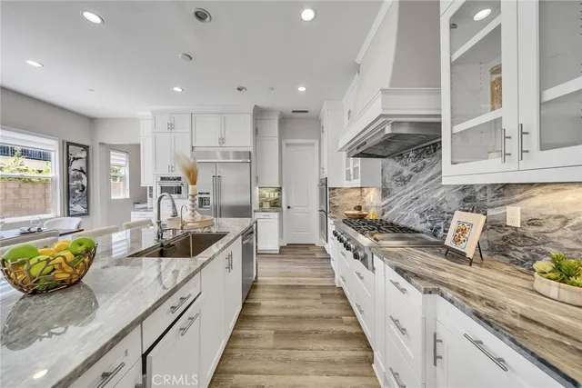 a utility room with sink dryer and washer
