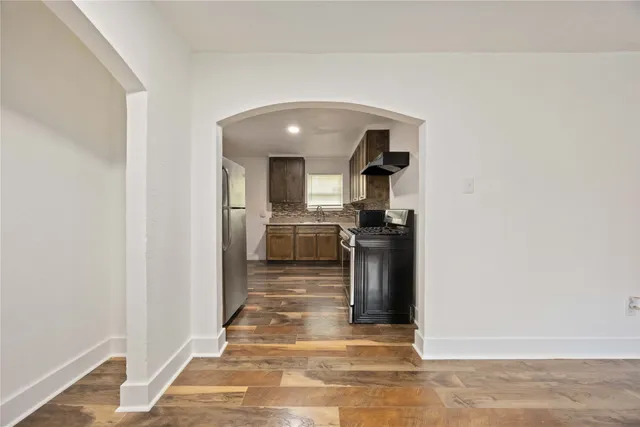 a view of a kitchen from the hallway