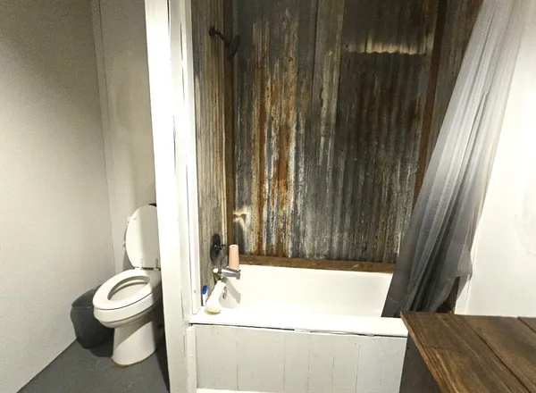 a kitchen with stainless steel appliances granite countertop a wooden floors